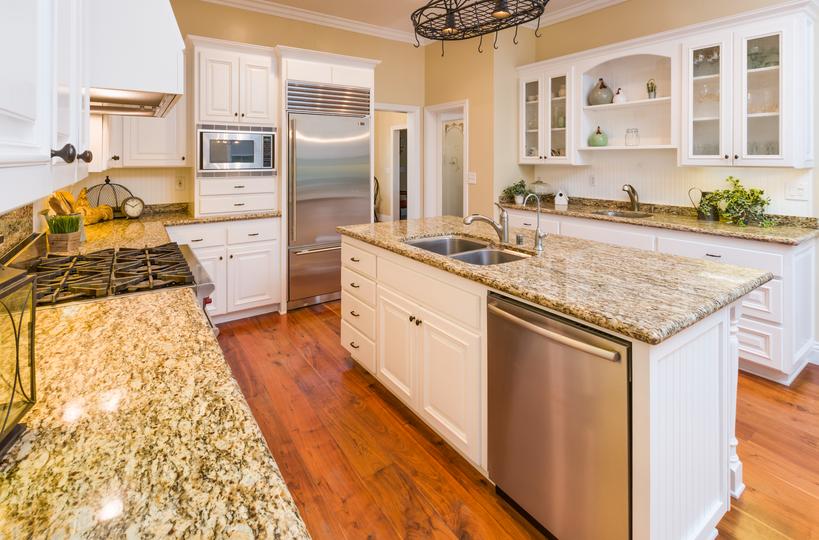 A modern kitchen with sleek concrete countertops