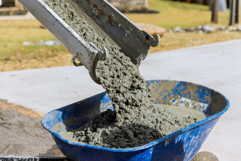 A Concrete truck pouring a foundation