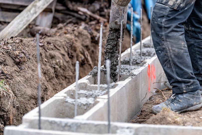Concrete footings being poured for a new building