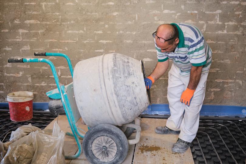 On-site concrete mixer pouring concrete for a foundation