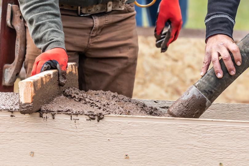 A concrete shed base being prepared