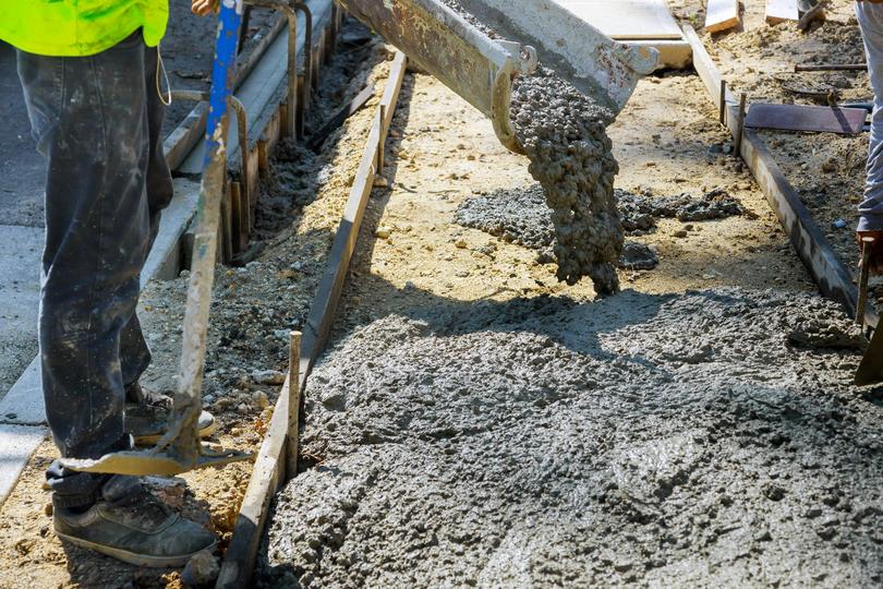 Ready-mix concrete truck delivering concrete to a construction site