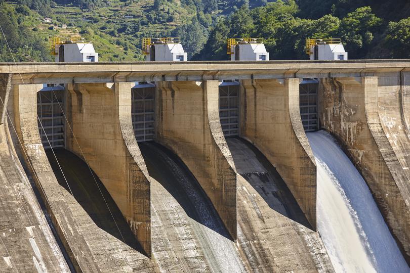A concrete dam holding back a reservoir of water