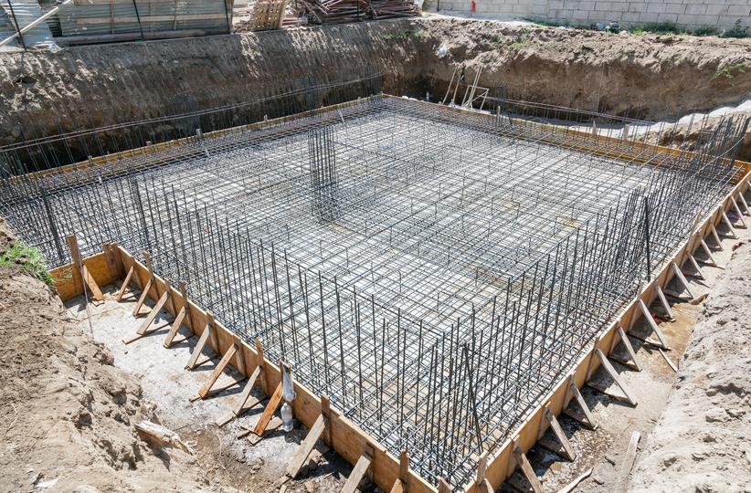 Concrete footings being poured for a new building