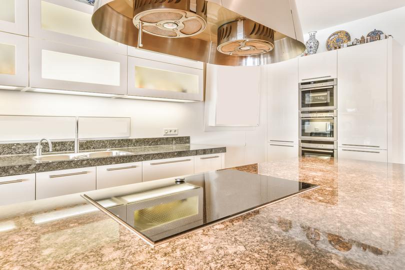 A modern kitchen with sleek concrete countertops