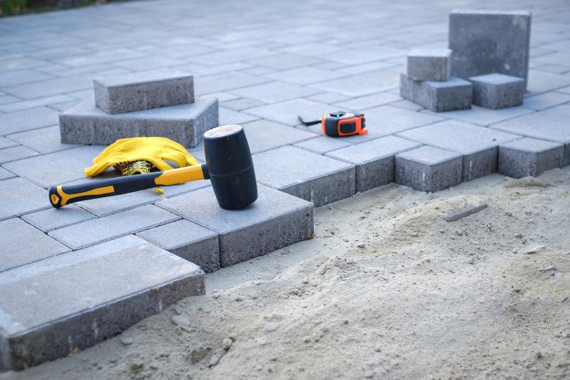 A modern concrete patio with stylish furniture