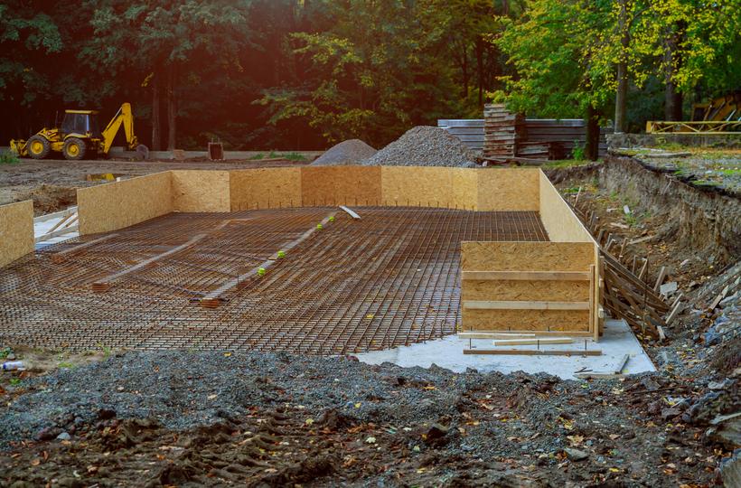 A concrete shed base being prepared