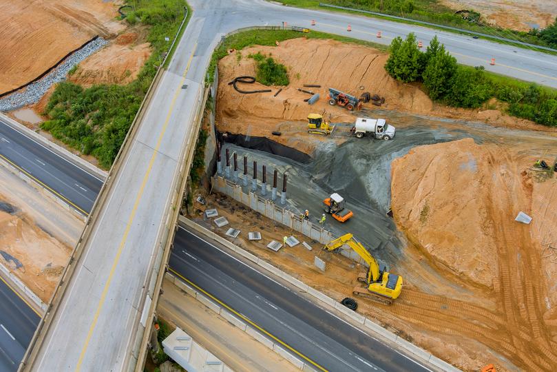 A newly constructed concrete road with lane markings