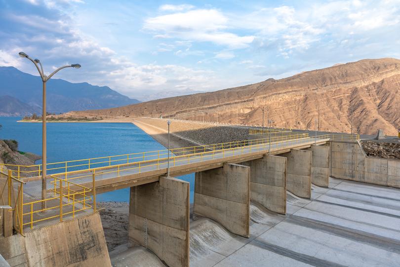 A concrete dam holding back a reservoir of water